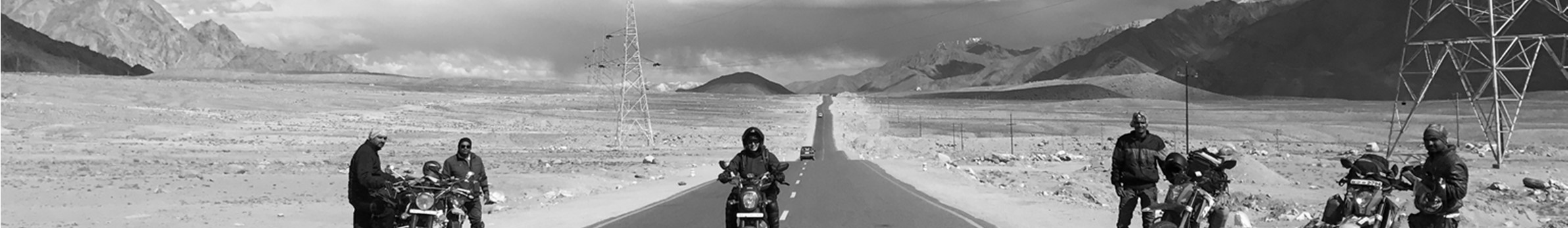 Cross Border Adventures riders on a desert mountain pass in Ladakh